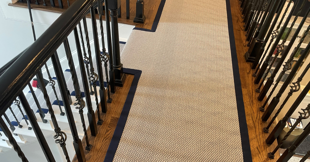 durable area rug in a hallway and stairway